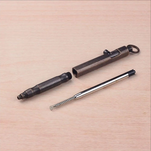 Solid brass hexagonal bolt tactical pen in brass and black finishes, showing machining detail.