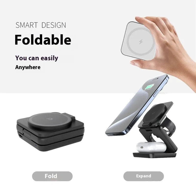White foldable magnetic wireless charging phone stand on a wooden desk next to a mobile phone.