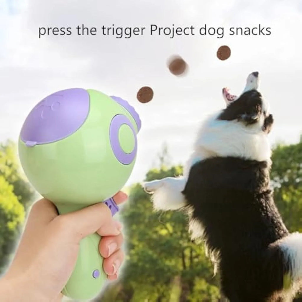 Green, orange, and pink dog treat launcher toy for interactive feeding and training