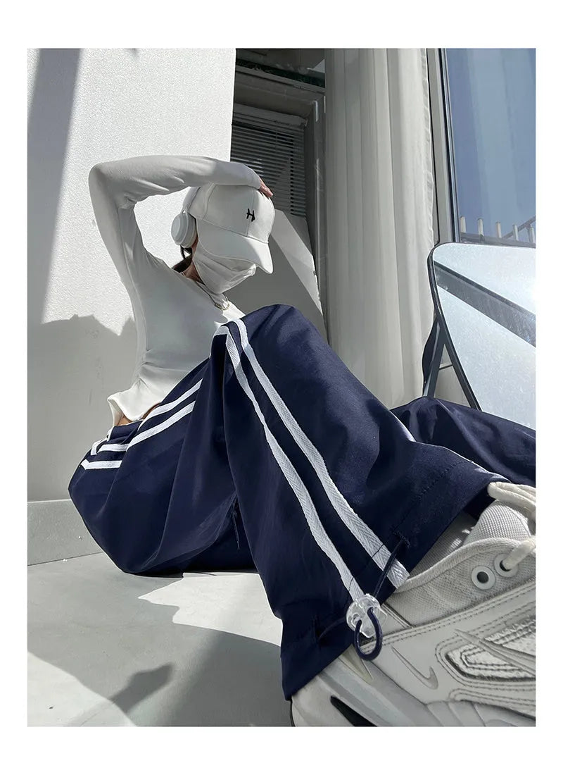 Women's slim straight trousers with parallel bar pattern in thin ribbed fabric, low waist design