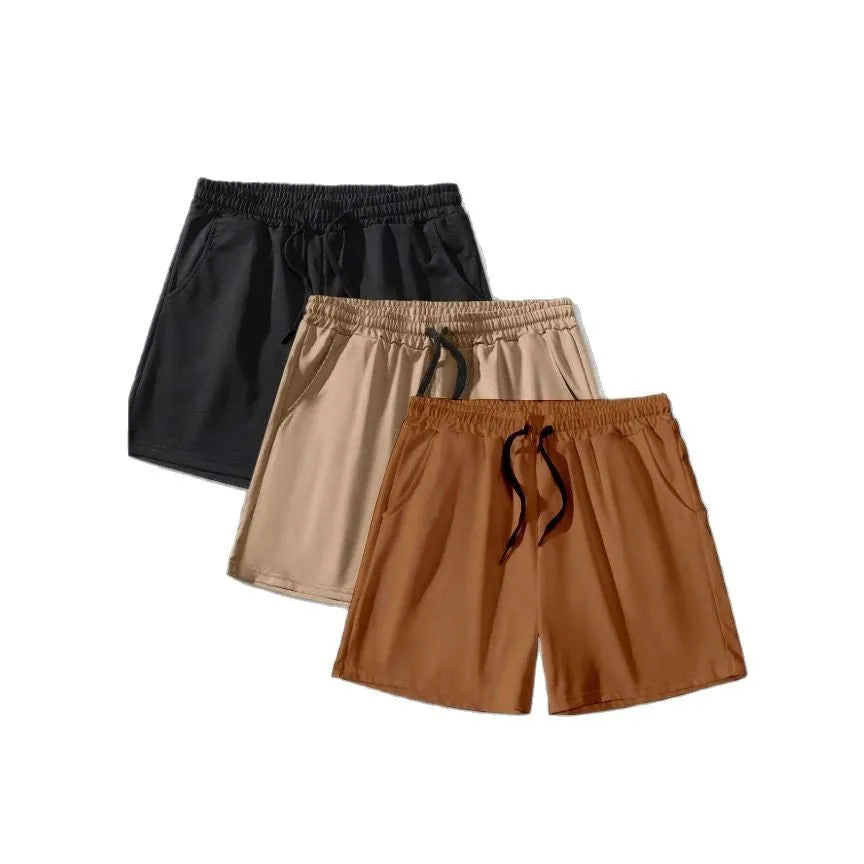 Three pairs of men's solid colour drawstring shorts in a pack, shown in black, khaki, and light brown.