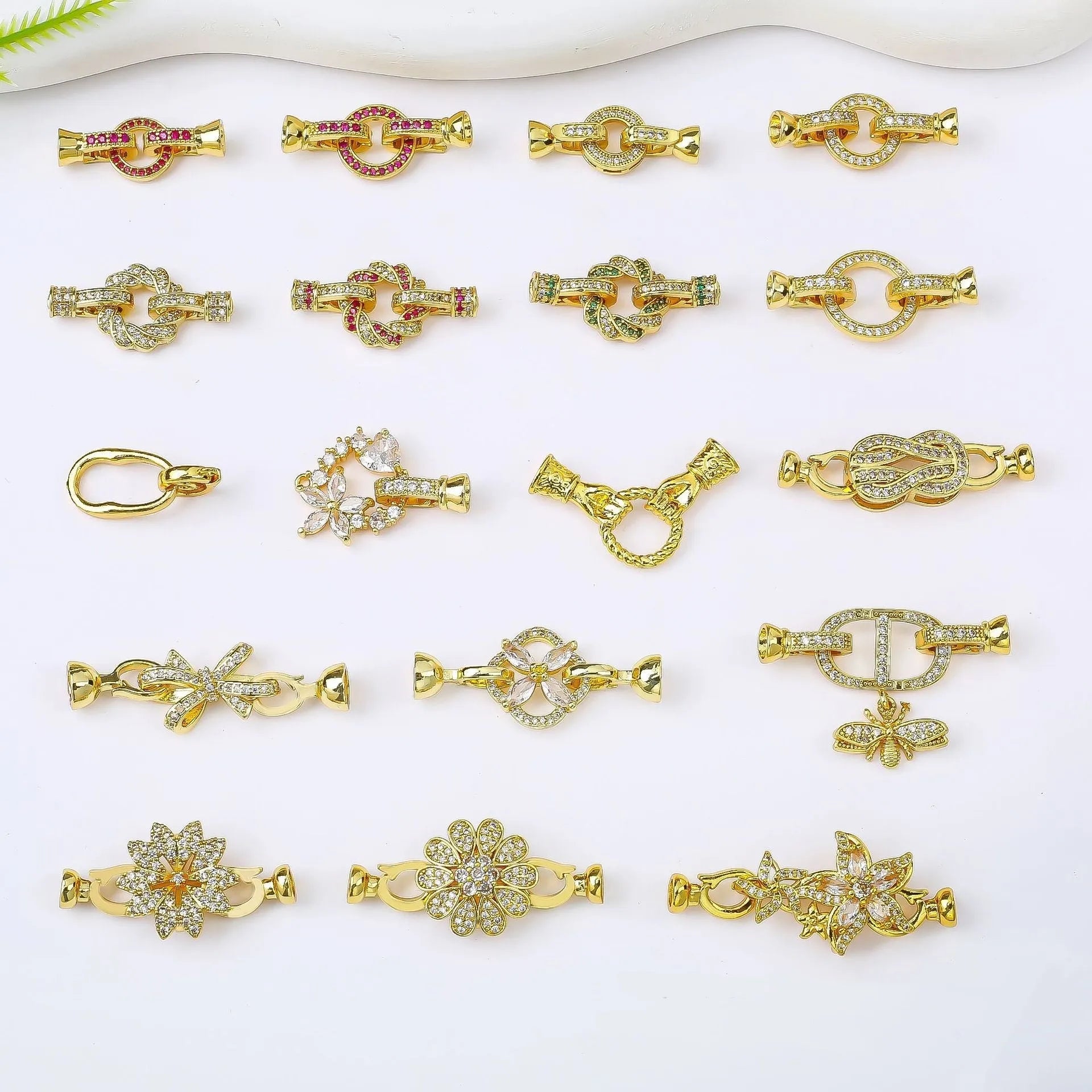 Small gold-coloured metal necklace clasp with a chain buckle for DIY jewellery making.