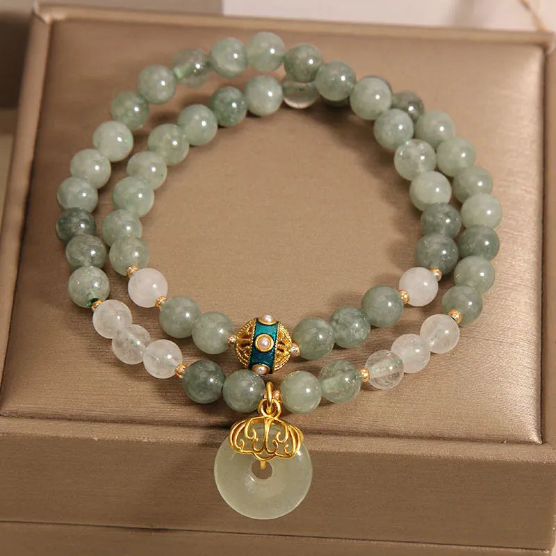 Women's double-layer aventurine jade bracelet with safety buckle and rhinestones.