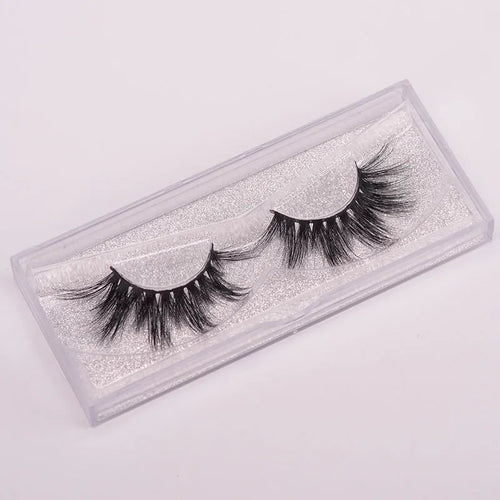 Handmade 5D volume false eyelashes made from mink hair with a storage case and application brush.