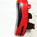 Black and red hand-held martial arts target pad with buckle strap on the back.