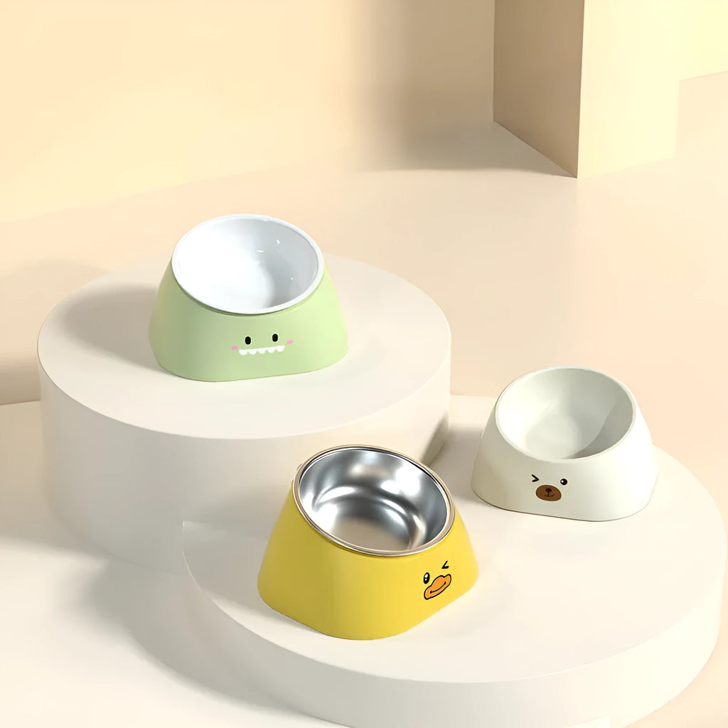 Green elevated pet feeding bowl with tilted stainless steel insert and wide anti-slip base.