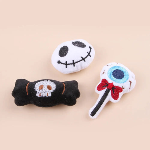 Small cat teaser wand with a soft plush head in eyes, candy, or skull design