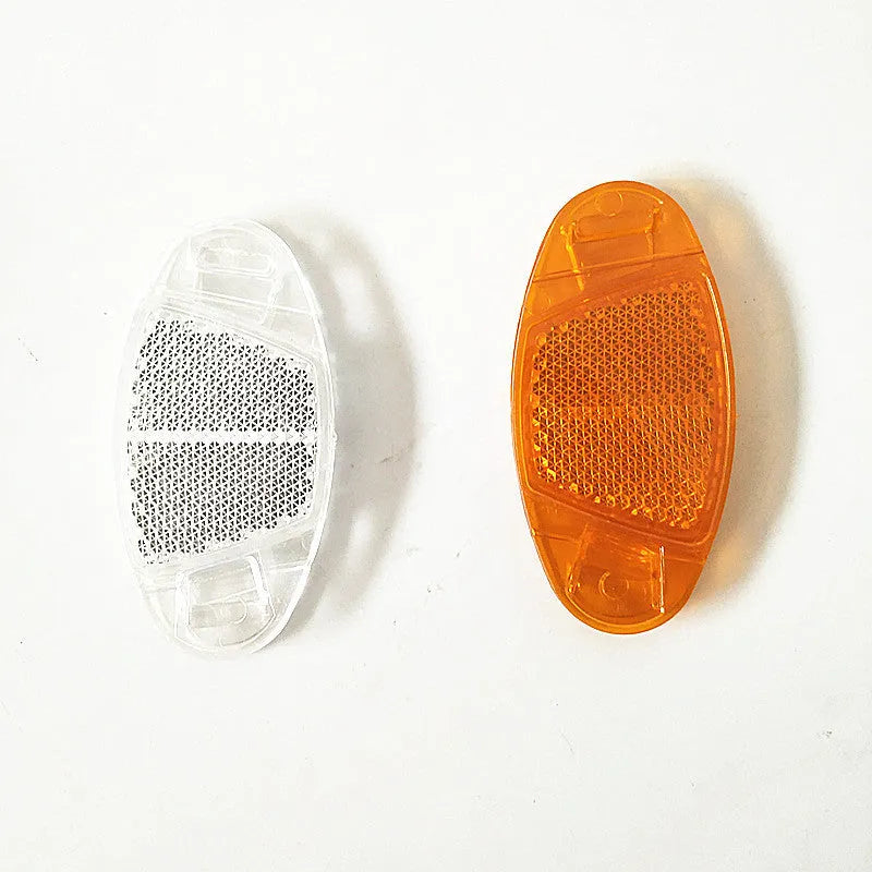 Yellow and white bicycle wheel reflector decorations for spokes measuring 7.2cm by 3.5cm