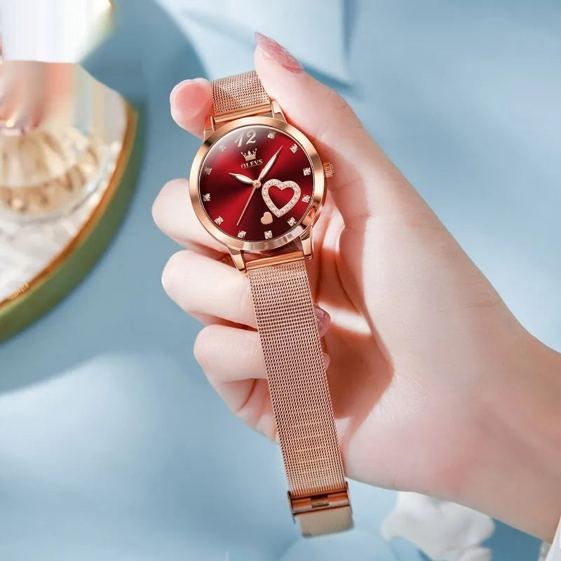 Women's mesh strap watch with rose shell casing showing six face colour options