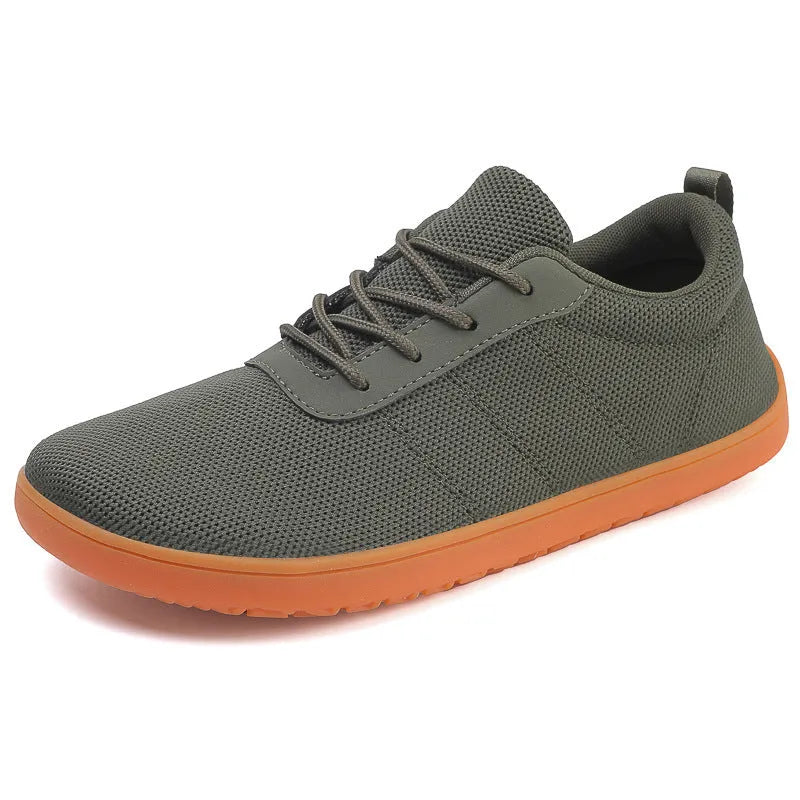 Men's black Flyknit walking shoes with wide round toe and flat rubber sole on a white background.