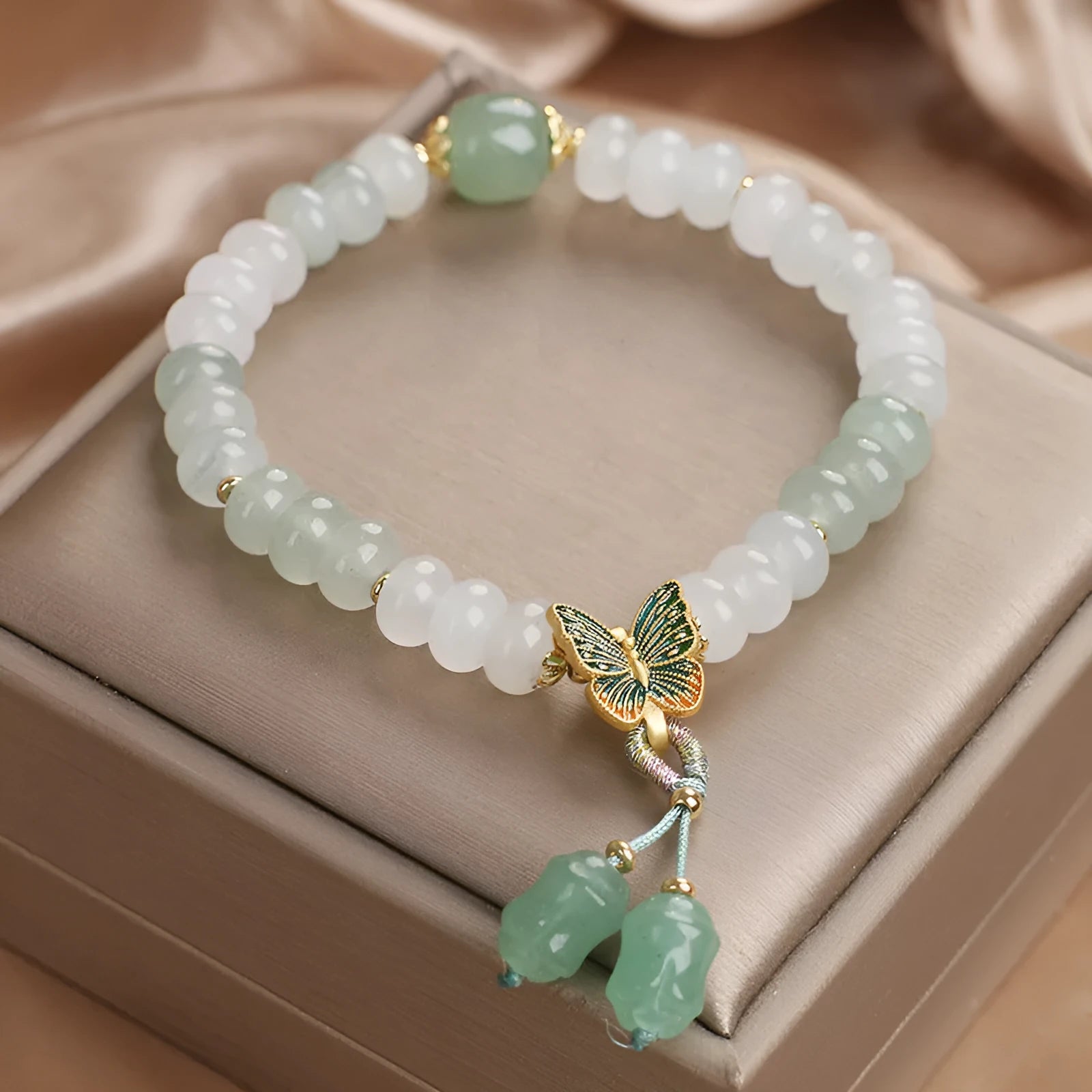Green crystal women's bracelet with Tian Shan Cui abacus beads and retro butterfly tassel design
