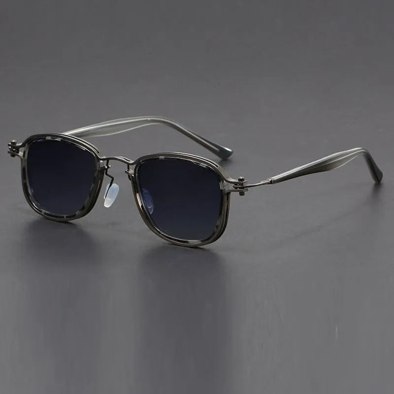 Retro style square sunglasses with a mixed metal and plastic frame and AC lenses.