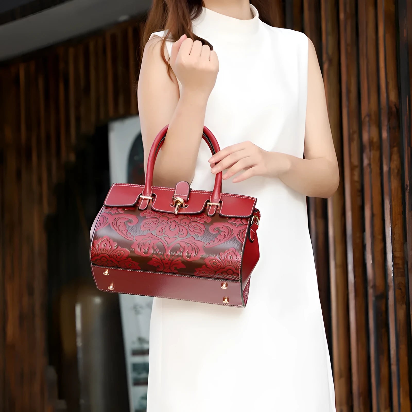 Genuine leather vintage embossed women's crossbody bag in black showing laptop compartment interior
