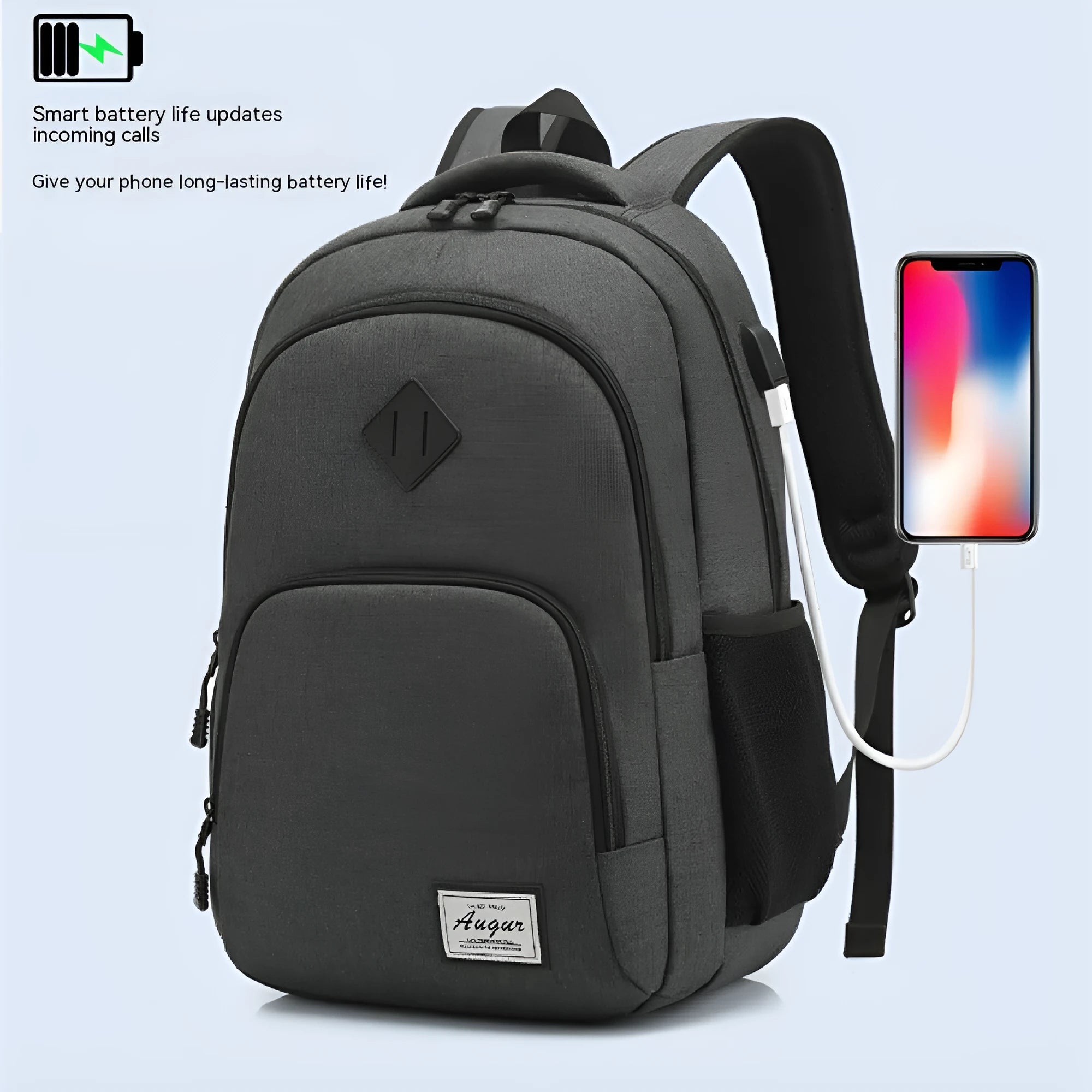 Gray nylon backpack with USB charging port and trolley sleeve on a suitcase.
