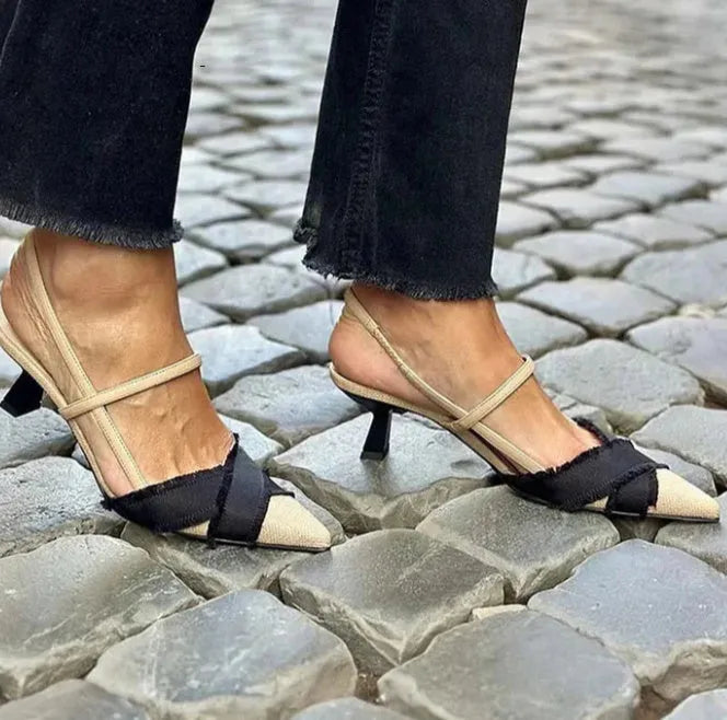 Apricot black women's pointed toe stiletto heel sandals with a buckle strap fastening.