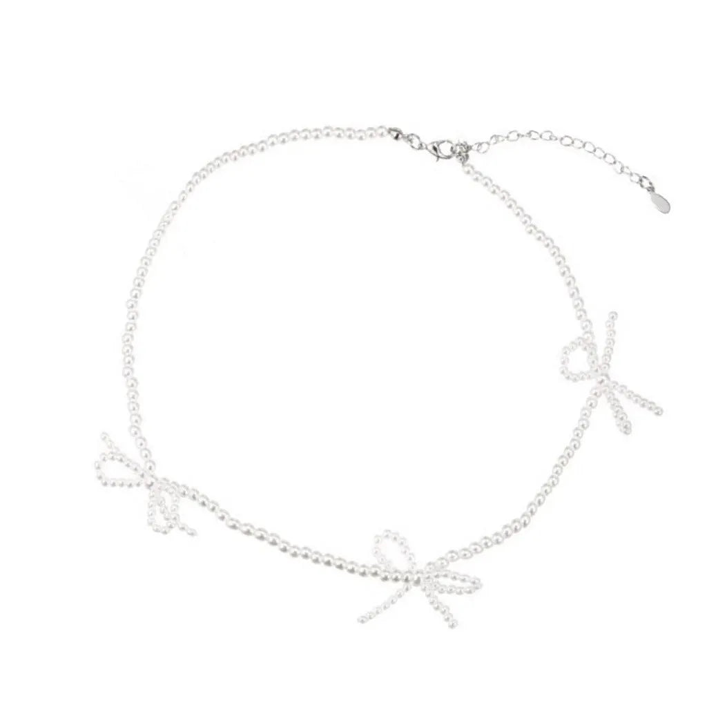 White sweet bow pearl necklace for women on an adjustable 31cm-40cm chain.