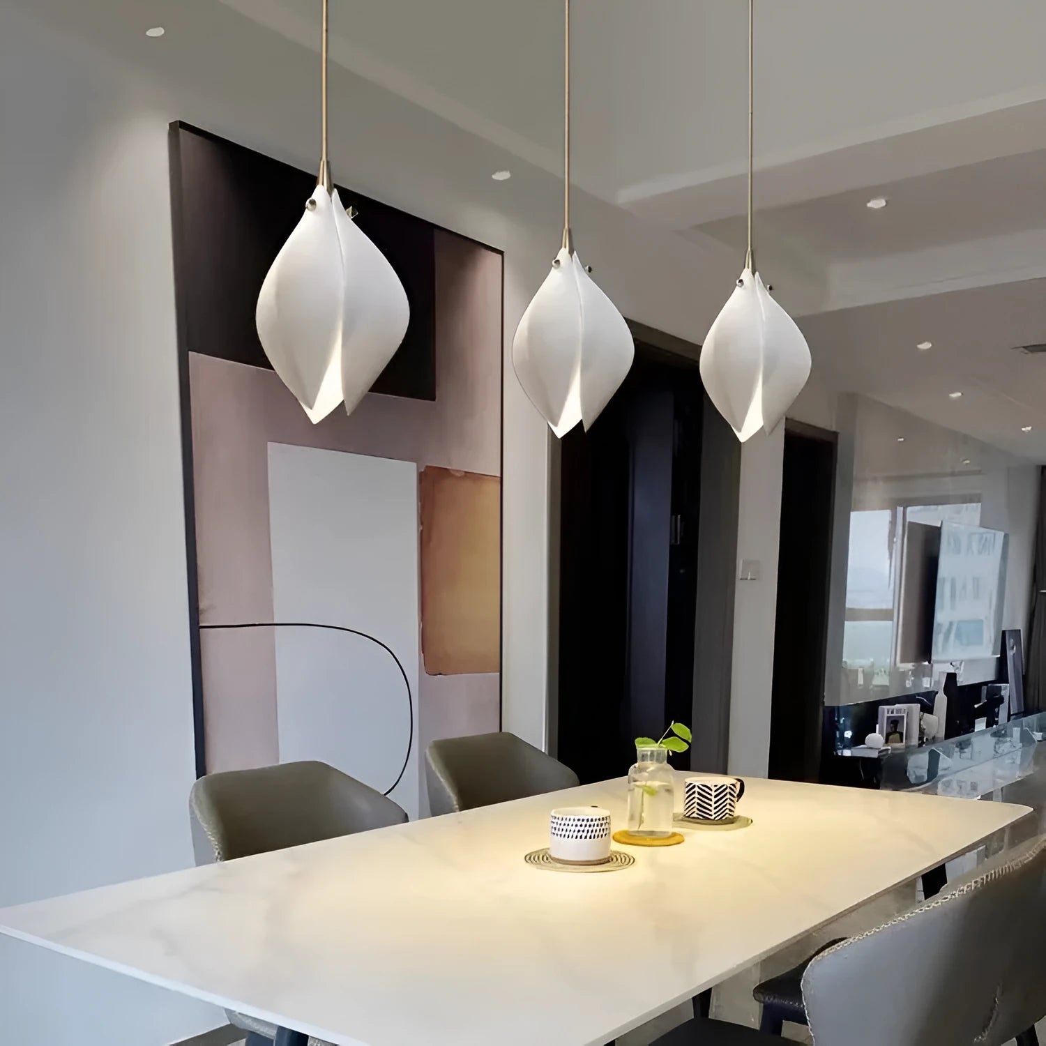 White ceramic magnolia flower single-head pendant ceiling light with dimmable bulb.