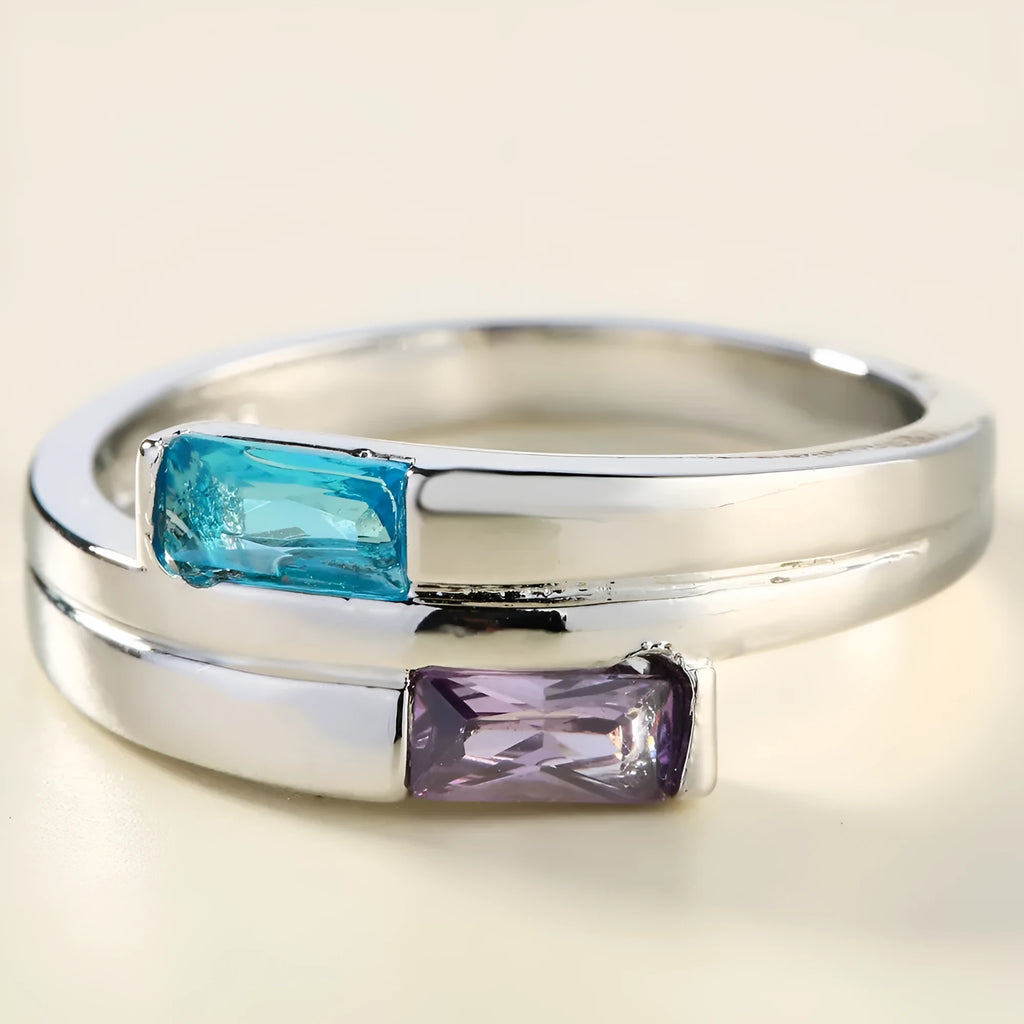 Silver colour copper electroplated ring with inlaid zircon stone on a band