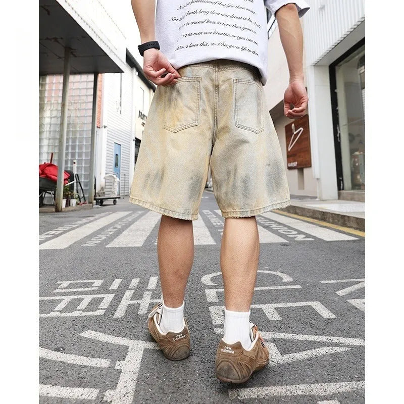 Light blue men's denim shorts with distressed wash and straight-leg silhouette