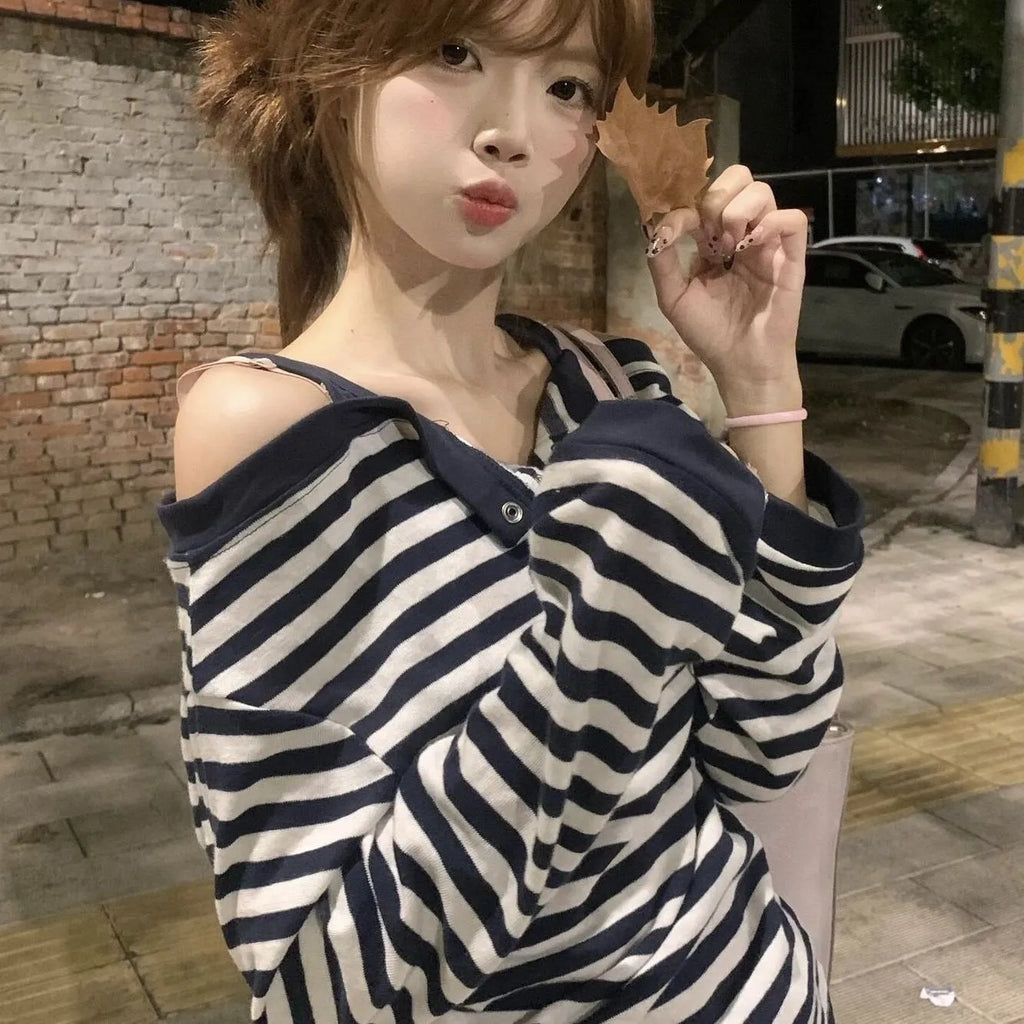 Dark blue Korean-style oversized women's long-sleeved T-shirt with embroidery, stripes, and button details on a soft viscose fabric.