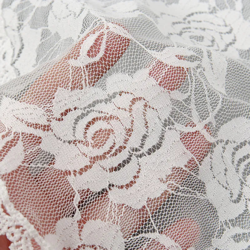 Round white floral bridal head cover decoration accessory on a 30cm background.