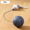 Automatic rolling cat toy with plush mouse on a hard floor