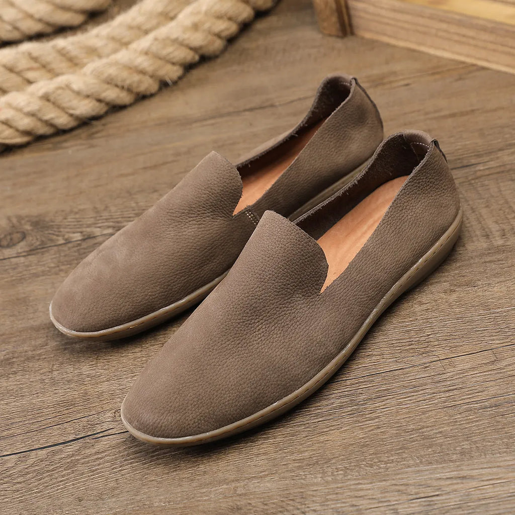 Handmade grey men's casual shoes with a wedge heel and leather upper.