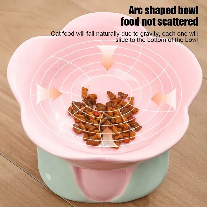 Blue floral patterned ceramic raised pet bowl with non-slip base for cats or small dogs.