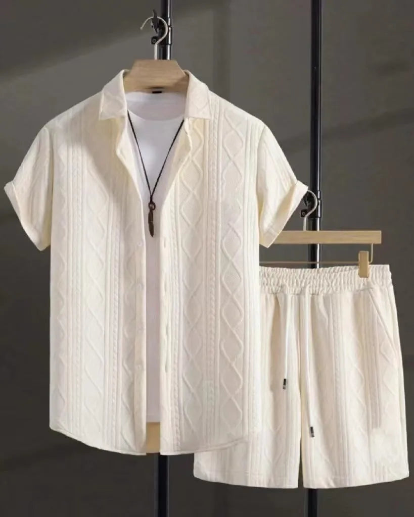 Man wearing a beige short sleeve jacquard suit shirt with matching shorts from a two-piece set.