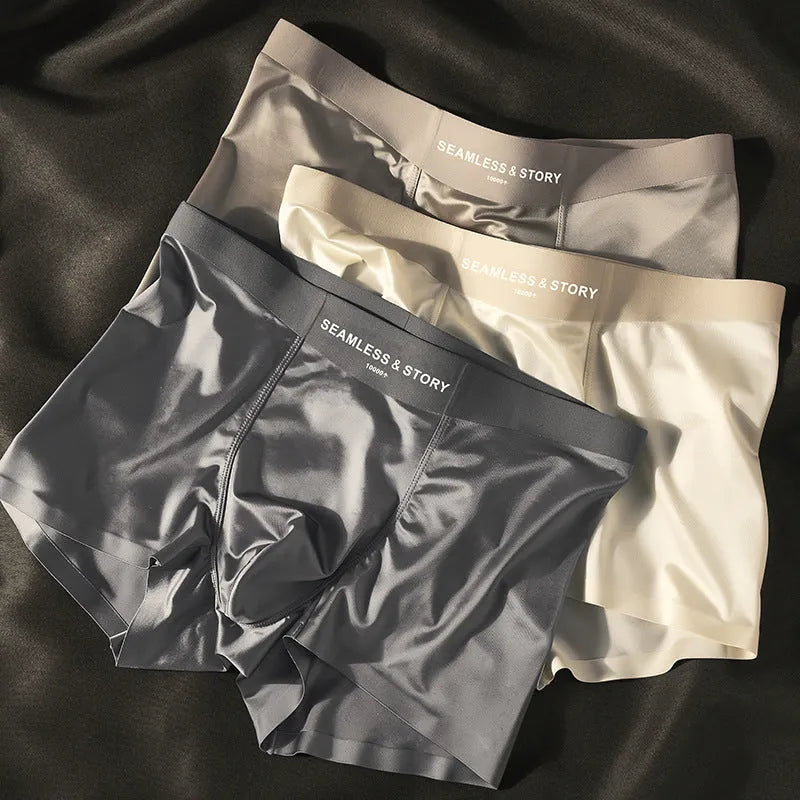 Men's solid colour ice silk nylon underwear in mid waist design on a neutral background.