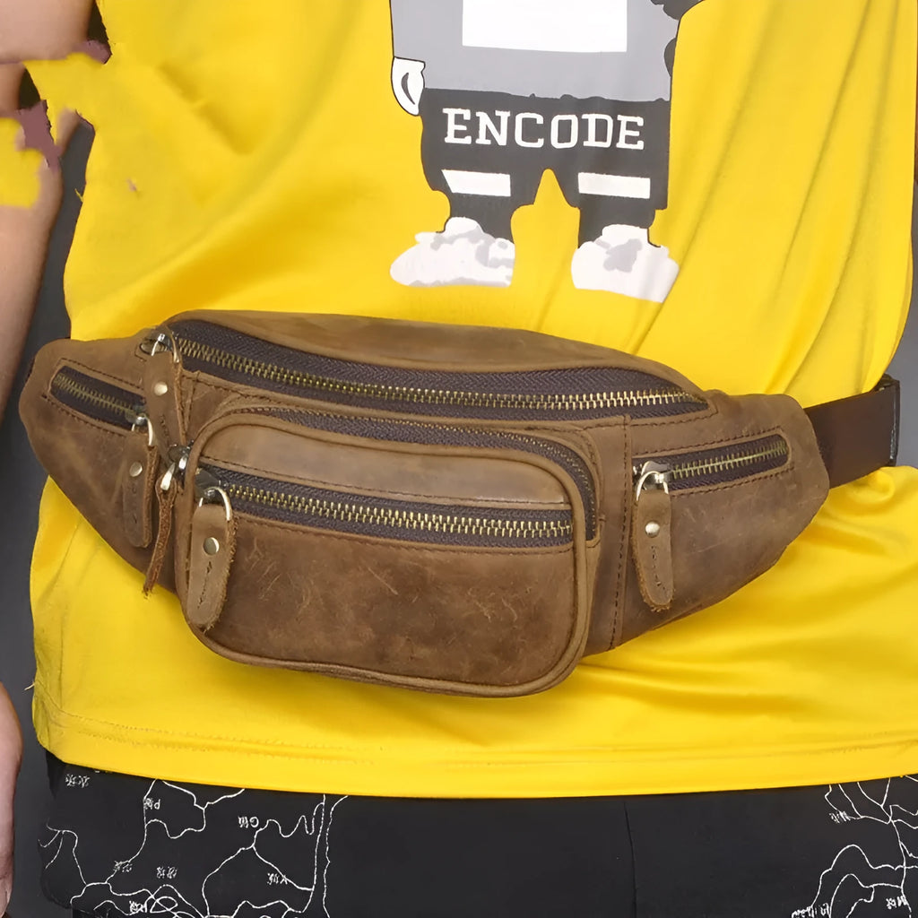 Brown leather retro messenger bag with single shoulder strap showing front compartment and silver hardware