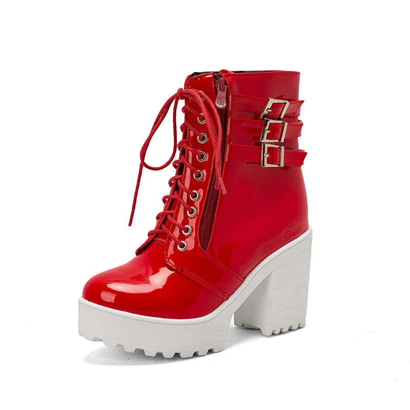 Women's black thick-heel ankle boots with round toe and front lace-up design.