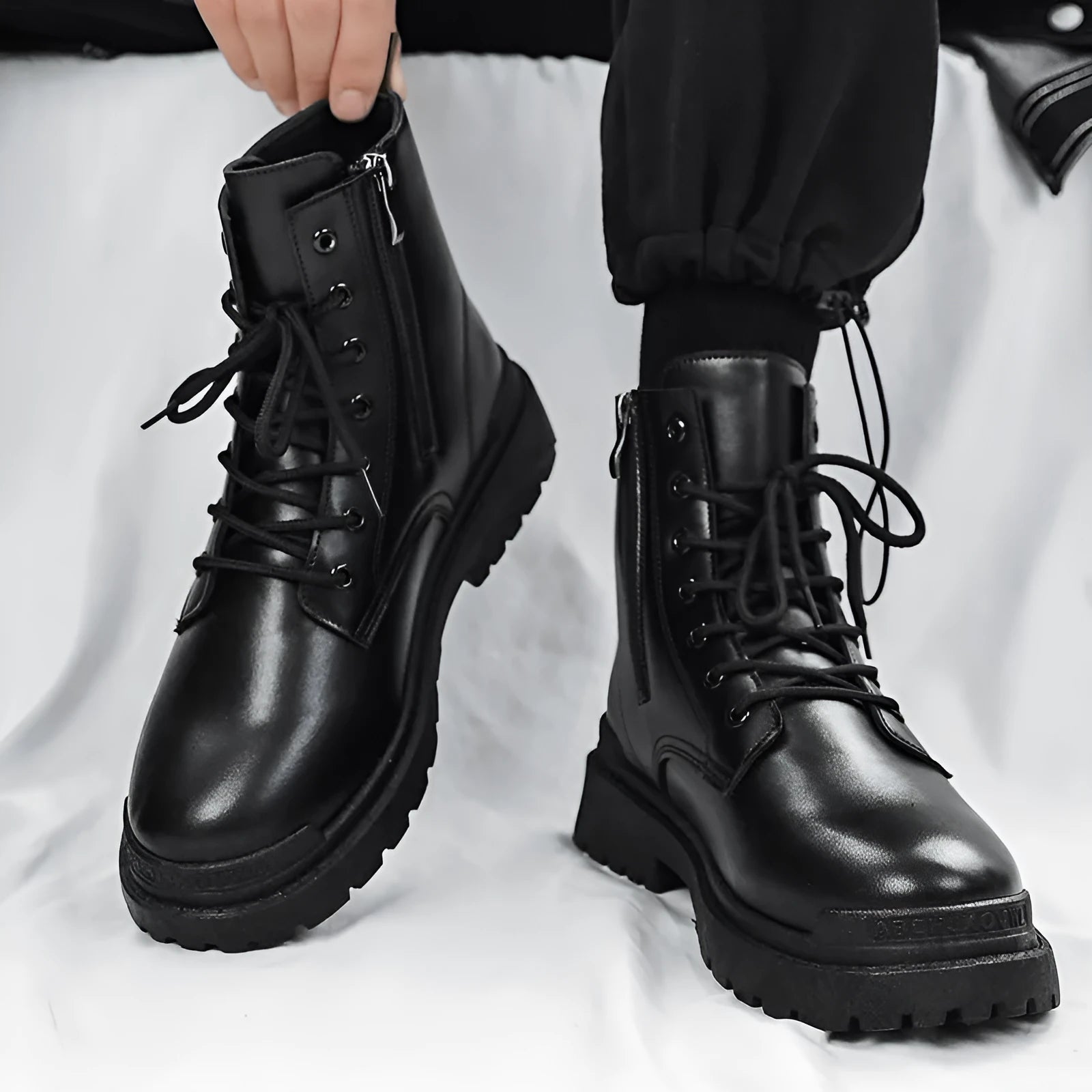 Men's black mid-top British leather style boots with waterproof uppers and rubber soles