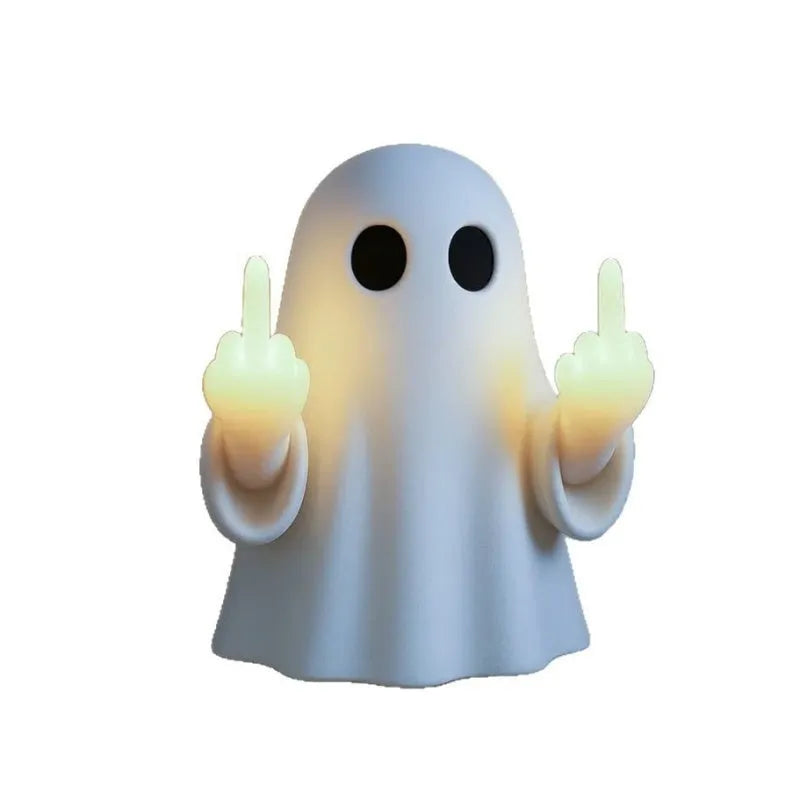 Small white modern ghost statue night light for Halloween decoration on a table.