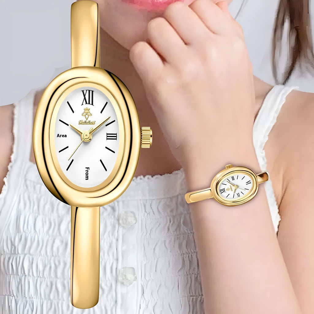 Women's slim oval retro quartz watch in gold colour on wrist