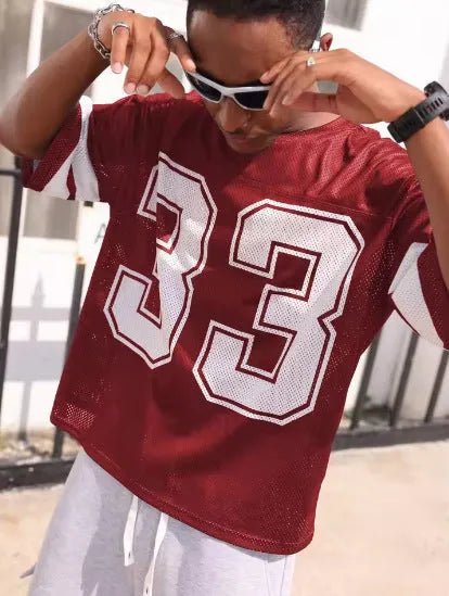 Men's mesh sports jersey in cartoon print with short sleeves and round neck in one of five colour options