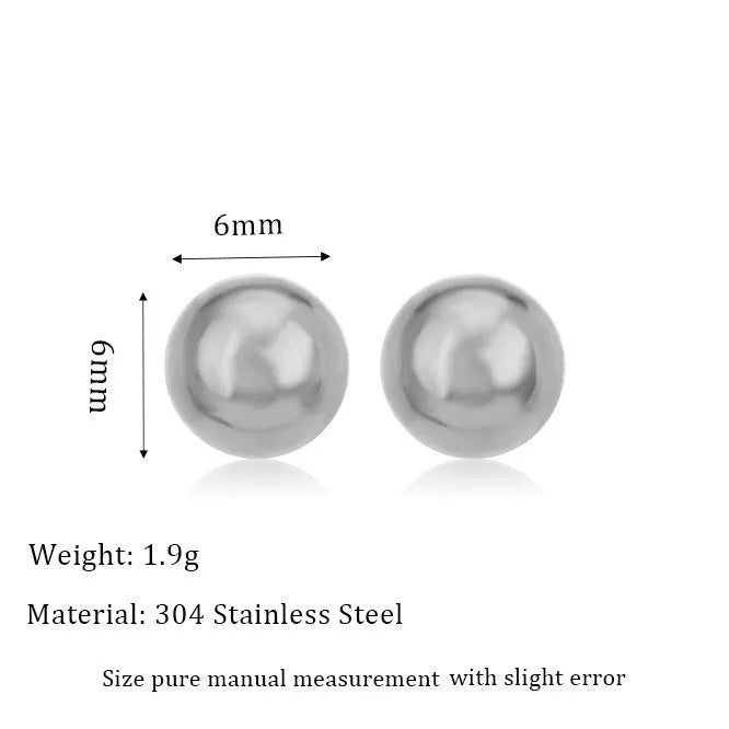 Stainless steel ball stud earrings in gold and silver finishes on a grey background.