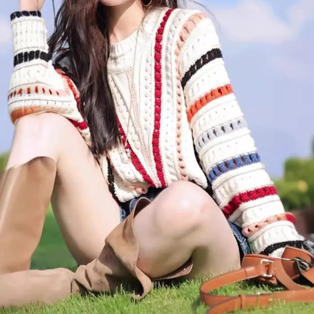 Colourful rainbow striped loose-fitting sweater with batwing sleeves and round neck
