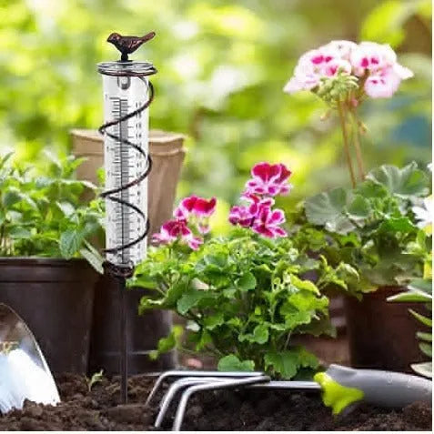 Cast iron garden rain gauge with hummingbird design showing 0-800ml water capacity