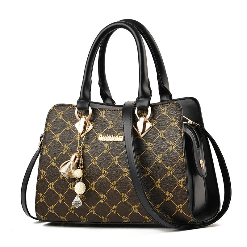 Women's geometric print messenger bag in PU material with internal organisation pockets and zipper closure