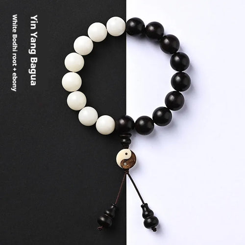 Handcrafted Bodhi seed bracelet with white Corypha Umbraculifera and Blackwood beads in eight-diagram pattern