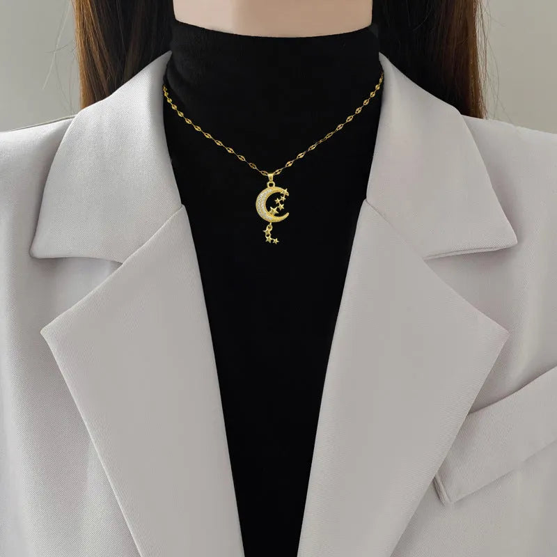 Silver tone necklace with moon-shaped copper pendant on stainless steel chain