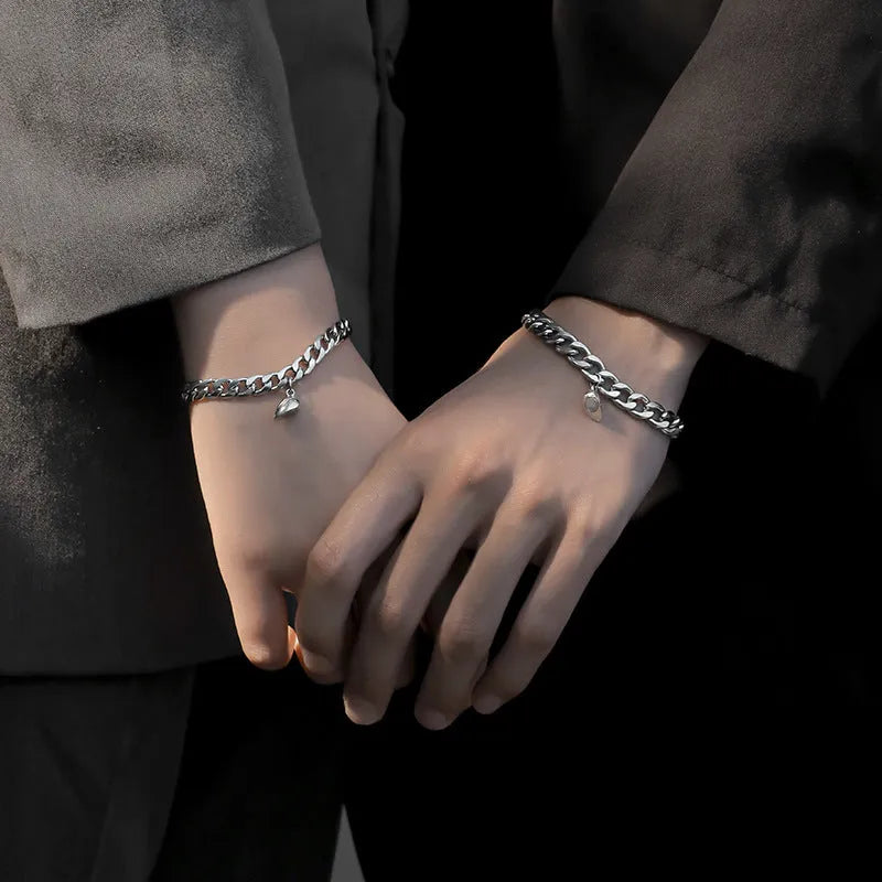 Silver magnetic couple bracelet with heart charm on stainless steel chain