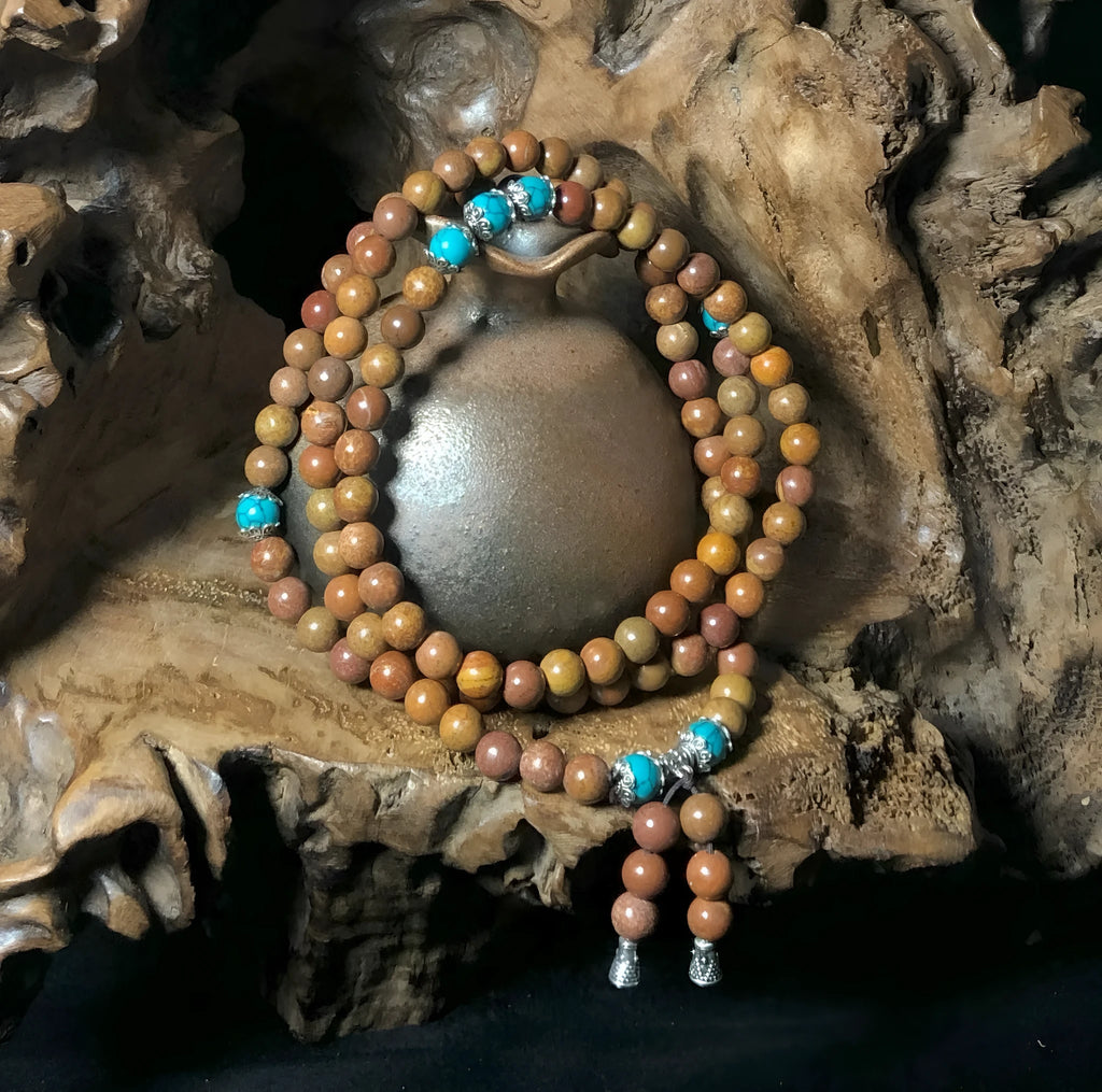 Handmade 108-bead lvzhu stone bracelet with 5-6mm geometric beads on wrist