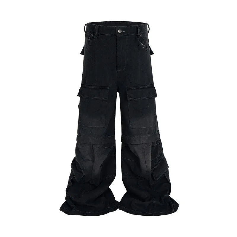 Black washed-out cotton overalls with multiple pockets and a detachable micro-pull design on a hanger.