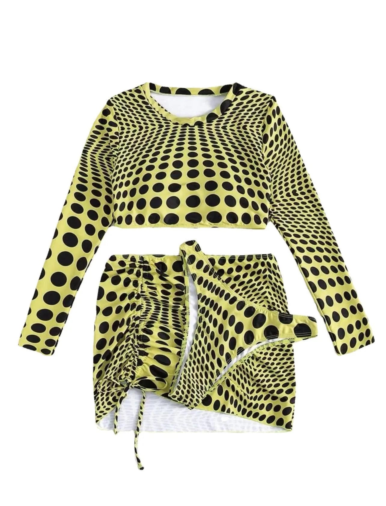 Women's green polka dot three-piece swimsuit set showing bra top and matching skirt