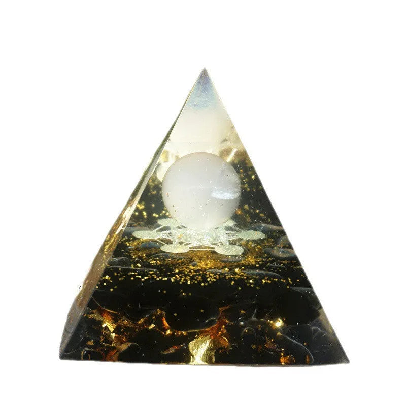 Clear epoxy resin pyramid ornament with embedded coloured crystal gravel inside, measuring 6cm.