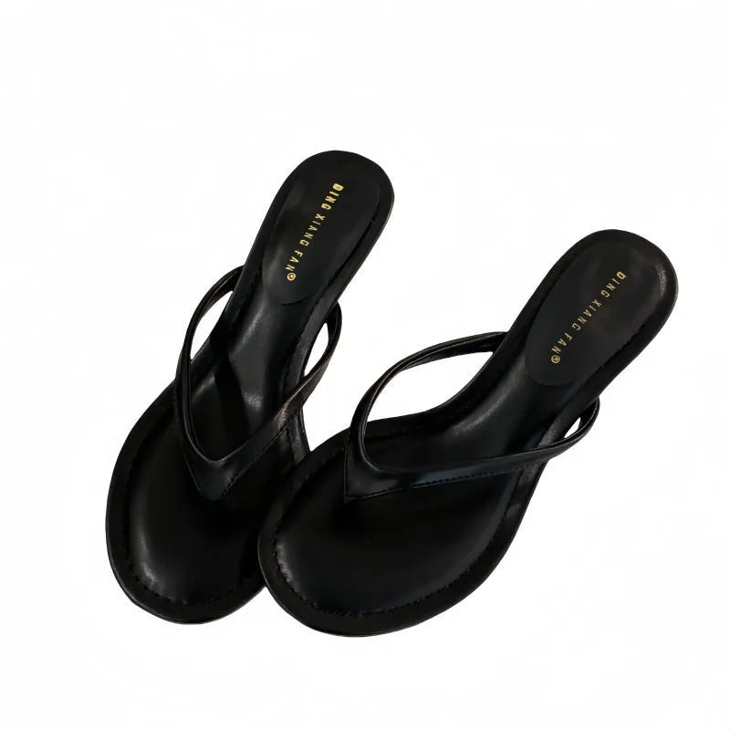 Women's rubber stiletto flip-flop sandals in black and camel colours on a white background.