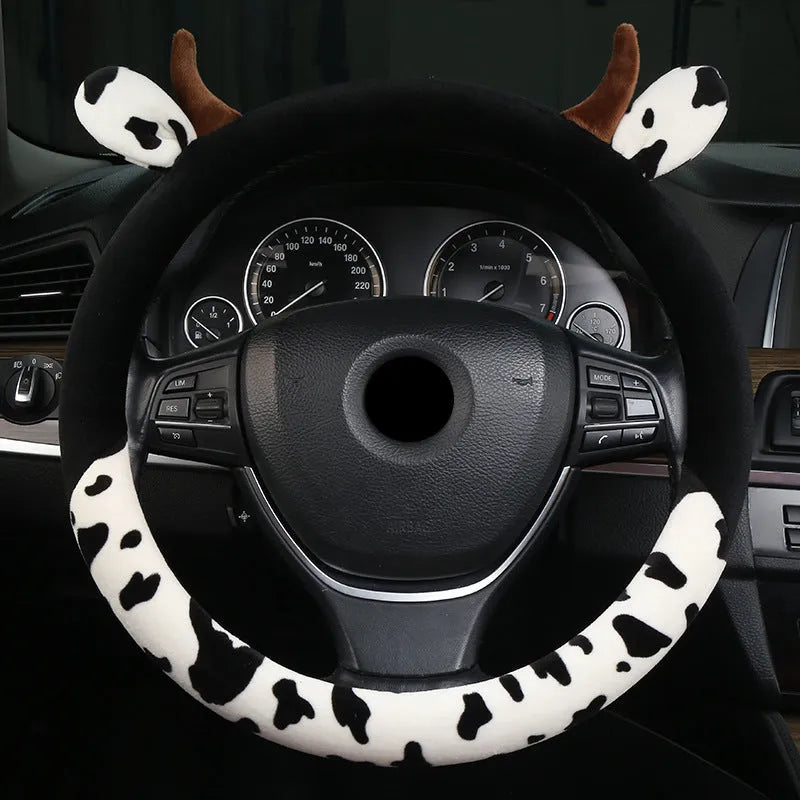 Short plush car steering wheel cover with protective handle in black colour showing 38cm diameter measurement