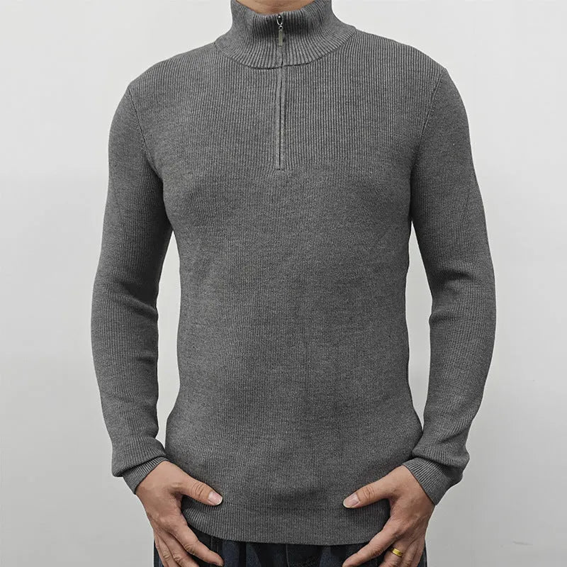 Man wearing a gray half-turtleneck zip sweater in British style for casual leisure wear.